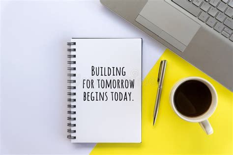Business Motivational Words On A Book Building For Tomorrow Begins