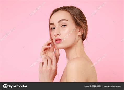 Beautiful Young Girl Touching Her Perfect Skin On Pink Background