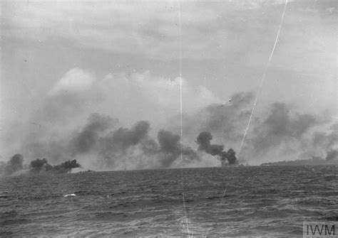 BATTLE PRACTICE FOR BRITAIN S EASTERN FLEET LAYING A SMOKE SCREEN AUGUST ABOARD HMS