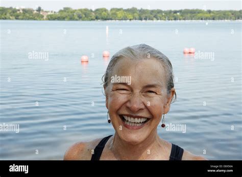66 Year Old Senior Woman Swimming In Lake Stock Photo Alamy