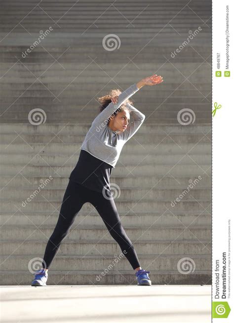 Young Woman Stretching Exercise Outdoors Stock Image Image Of Gray