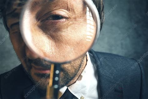 Man Looking Through Magnifying Glass Stock Image F0216864