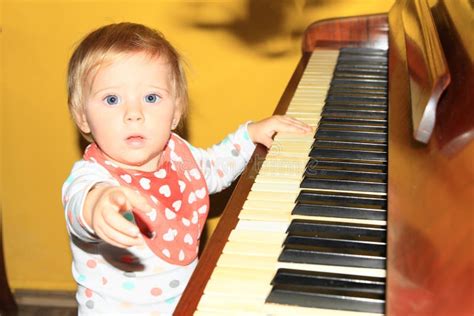 822 Little Baby Girl Playing Music Piano Stock Photos Free And Royalty