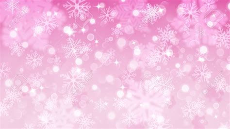Christmas Background With White Blurred And Clear Snowflakes On Pink