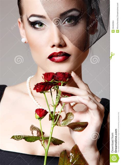 Beautiful Woman With Dark Red Roses Flower In Veil Retro