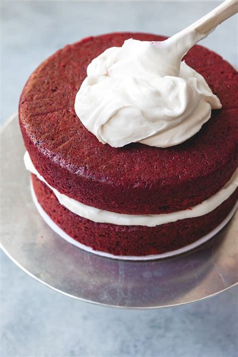 The only red velvet cake recipe you'll ever need! An image of stacked layers of red velvet cake being frosted with cream cheese icing. | Velvet ...