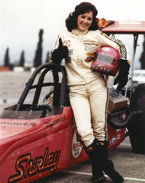 Posterazzi Bonnie Bedelia Posed In Car Racing Outfit Carrying Her