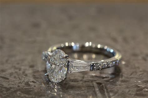 Custom Engagement Ring Featuring An Oval Diamond With Wide Tapered