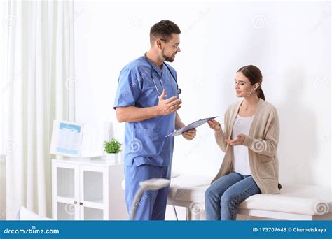 Doctor Consulting Patient In His Office At Hospital Stock Photo Image