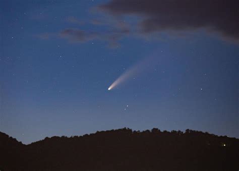 Comet Neowise Is Visible In Night Sky Outdoors