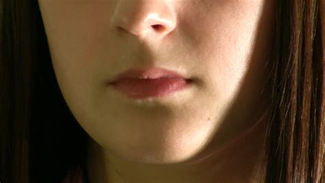 Womans Tongue Seductively Licking Lips Close Up Stock