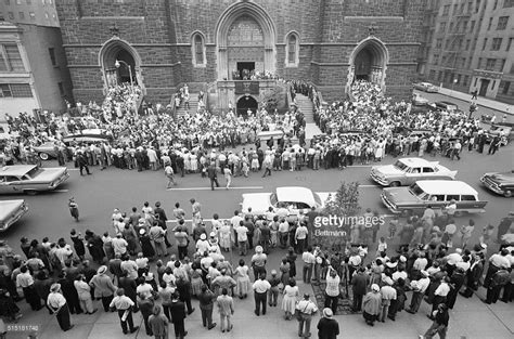 The quintessential jazz singer, whose reedy voice and laconic style accentuated the intensity of emotion in her performances. New York, NY- Crowds mill around St. Paul the Apostle ...