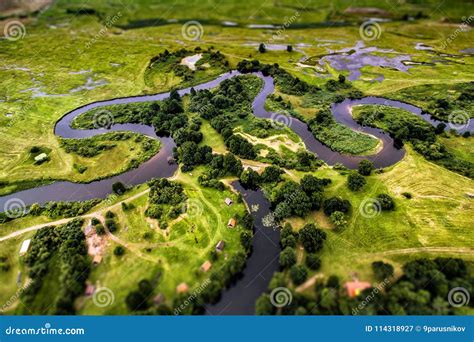 Top View Of The Valley Of A Meandering River Among Green Stock Image