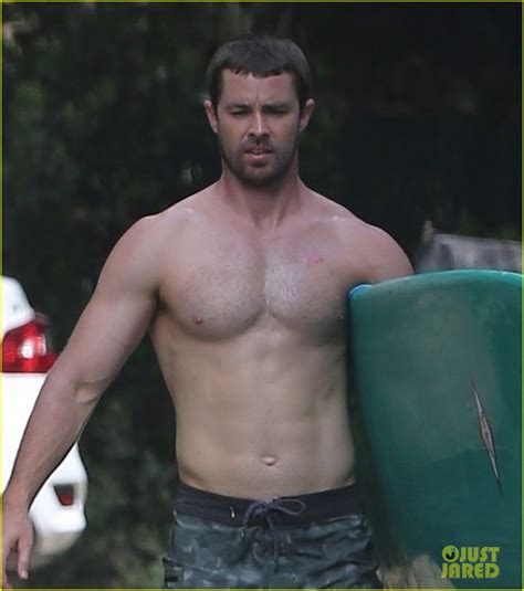 Chris Martin Goes Shirtless While Surfing In Malibu Photo