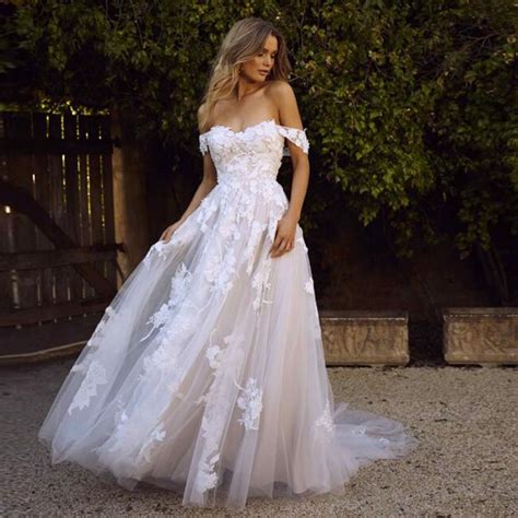 Even casual beach wedding dresses can benefit from a little sparkle! Lace Beach Wedding Dresses 2019 Off the Shoulder Appliques ...