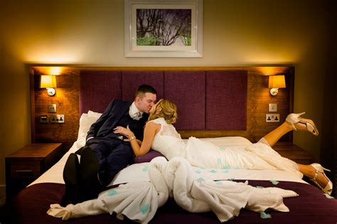A Newly Married Couple Kissing In Their Bedroom Suite Newly Married