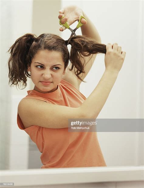 Girl Cutting Hair Photo Getty Images