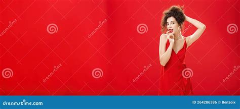 Seductive And Sensual Elegant Rich Lady In Red Evening Dress Combing Hair In Luxurious Hairstyle