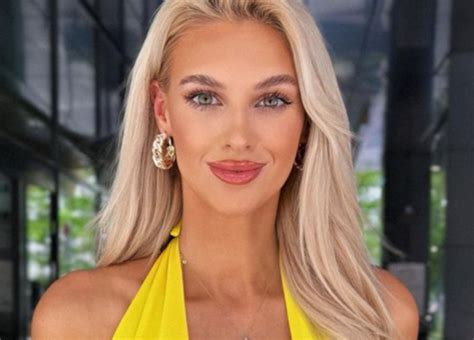 veronika rajek shows off massive cleavage in a yellow low cut top while on her euro tour page