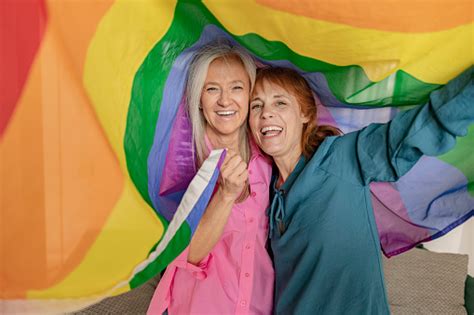 Two Senior Mature Women Hoist The Gay Rainbow Flag I Support The Lgbti
