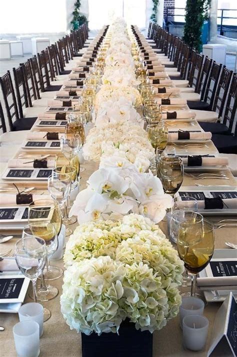 For long tables, use a galvanized steel trough for a long and low style. Gorgeous Long Hydrangea Centerpiece- B. Lovely Events