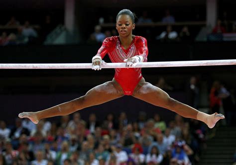Gabrielle Douglas Of The Us Performs On The Asymmetric Bars During