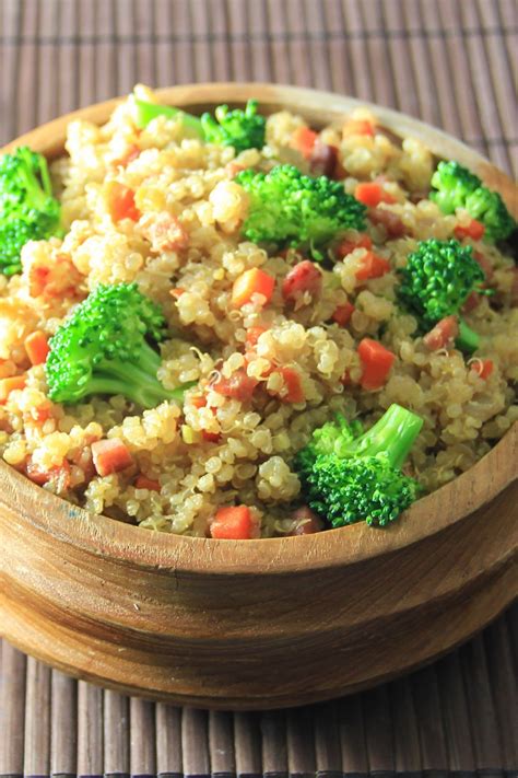 Close Up Image Of Quinoa Fried Rice In A Wooden Bowl On A Bamboo Mat Quinoa Fried Rice Fried
