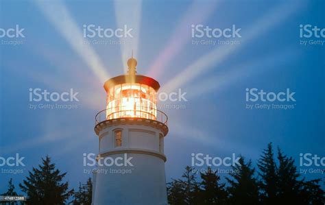 Lighthouse Beams Illumination Into Rain Storm Maritime Nautical Beacon