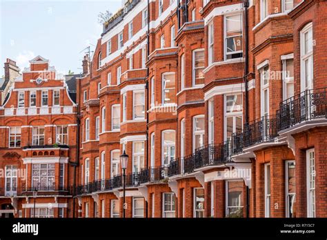 Row Of Houses With Red Brick Building In Victorian Style District