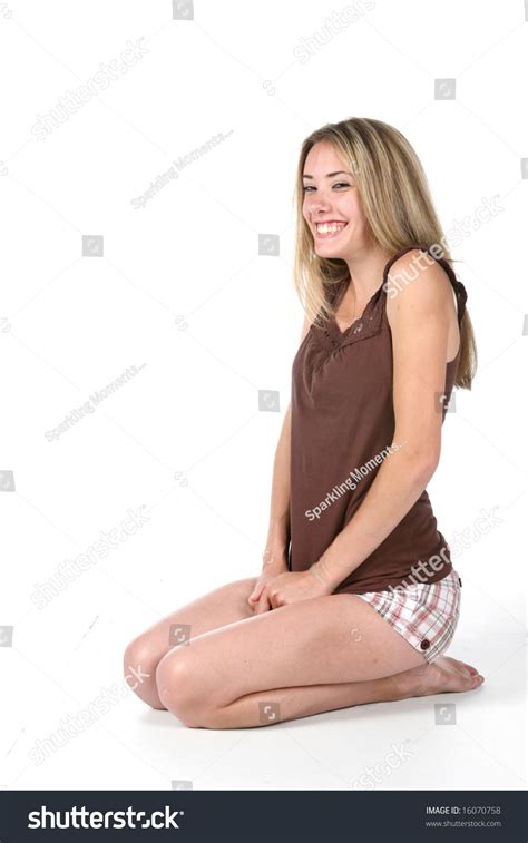Pretty Teen Kneeling And Smiling Stock Photo 16070758 Shutterstock