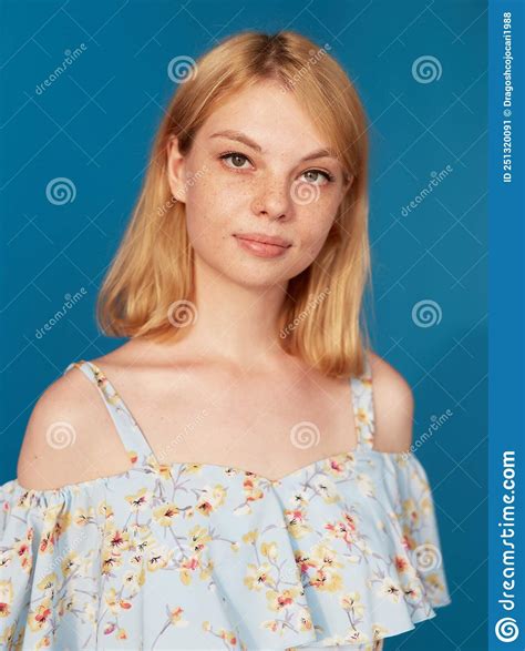 Adorable Blonde Young Woman With Blonde Hair Looking At Camera
