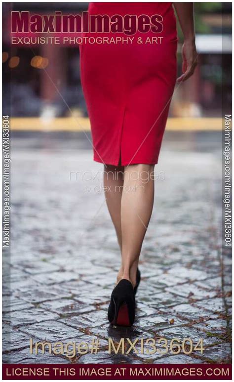Photo Of Rear View Of A Sexy Woman In Red Dress And High Heel Shoes