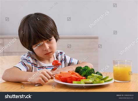 Cute Little Boy Refusing Eat Vegetables Stock Photo 2080830619