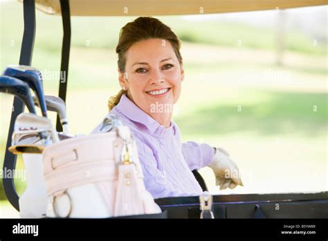 Portrait Of Woman Sitting In A Golf Cart Stock Photo Alamy