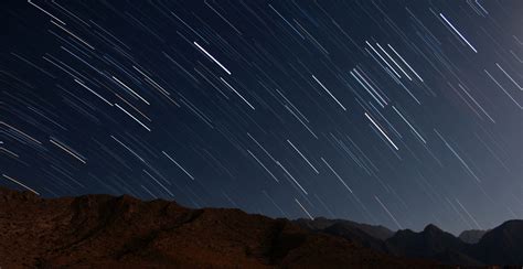 Star Trails Over The Mountains In Night Sky Image Free Stock Photo