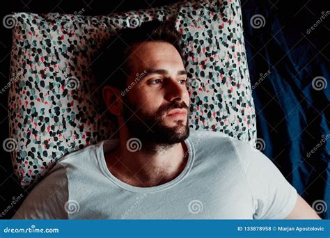 Young Man Lying In Bed Thinking Stock Photo Image Of Morning Sadness
