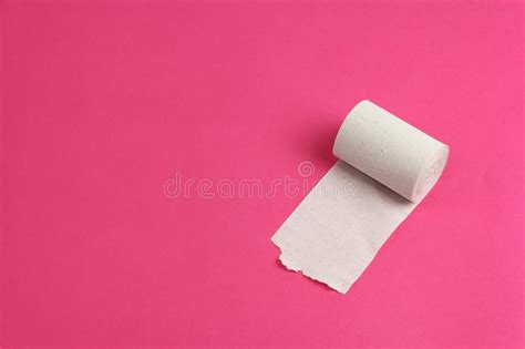 Roll Of Rough White Toilet Paper On Pink Background Close Up Copy