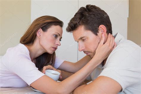 Woman Consoling A Sad Man At Home — Stock Photo © Lightwavemedia 42596035