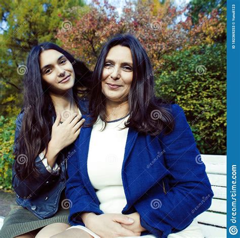 Mature Real Mother With Daughter Outside Autumn Fall In Park Recreation Concept Stock Image