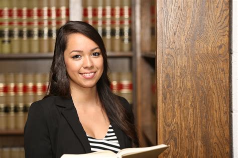 Young Female Hispanic Lawyer In Law Library Knk