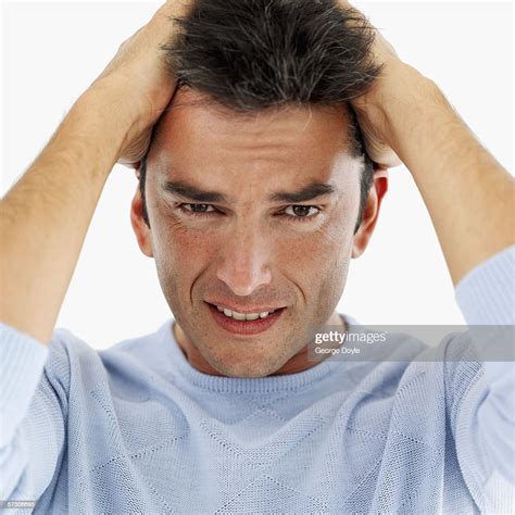 Portrait Of A Man With His Hands On His Head High Res Stock Photo