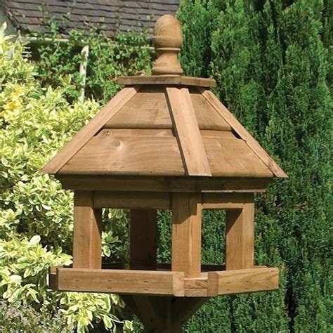 Garden mile® large universal 40cm clear squirrel baffle squirrel proof bird feeder accessory visit the garden mile store. Rowlinson Lechlade Bird Table with 4 Sided Wooden Hip Roof