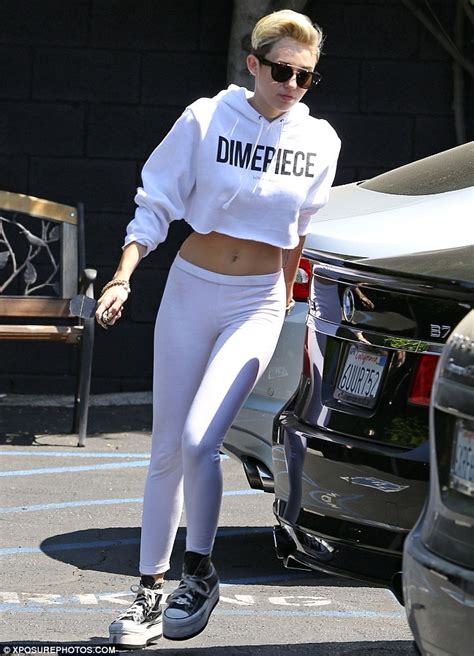 Miley Cyrus Bares Toned Midriff In Skintight Leggings As She Heads To