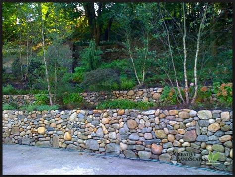 A retaining wall is a perfect diy project for a variety of skill levels. round river rock multi colored. | Retaining Walls ...