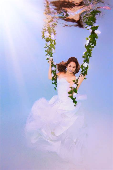 Leng yuting, 26, posing underwater for her wedding pictures at a photo studio in shanghai, ahead of her. Underwater Bride swinging on floral vine by Adam Opris ...