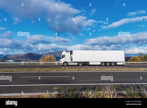 Refrigerated Truck Driving On The Highway Seen From The Side With A