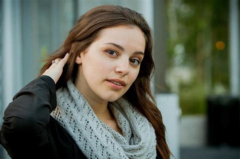 Portrait Of Young Beautiful Brunette Woman Touching Her Hair Photograph