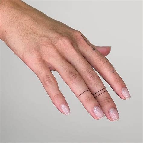 Simple Line Tattoos On Right Hands Fingers Small Hand Tattoos