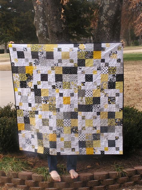 The pattern includes detailed color diagrams to guide you through every step of piecing the quilts. The Fleming's Nine: Black and Yellow Scrap Quilt