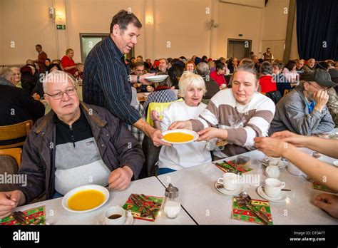 Homeless People Have A Christmas Dinner Served By Volunteers Of A Local Church Community Stock